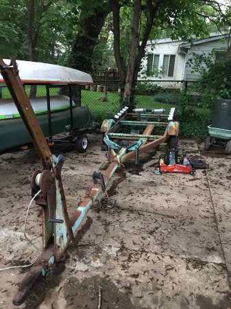 17 foot trailer and sailboat with stands