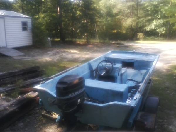 Boat with motor and trailer
