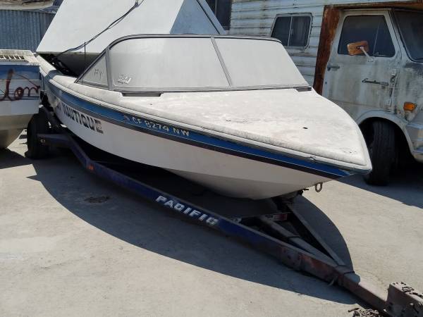 Blue and white free boat and trailer