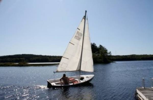 13' sloop. Chrysler LS 13 on the water