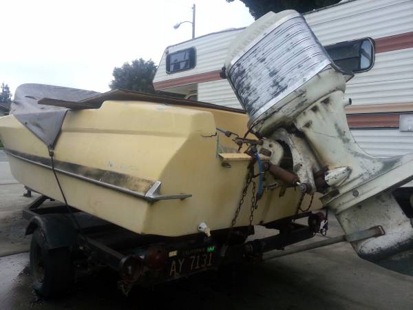 yellow project boat and trailer