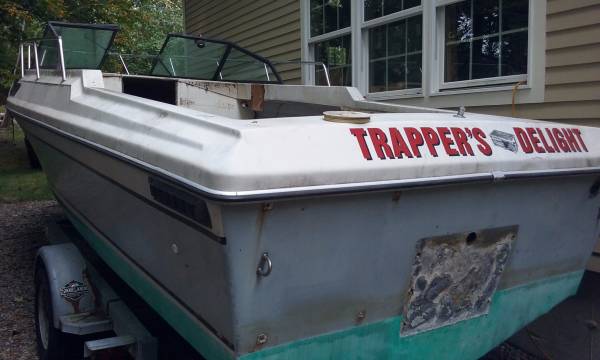 Cuddy Cabin boat on trailer from stern
