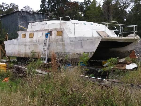 Liveaboard catamaran cruiser Side view