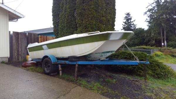 18' fiberglass tri-hull boat and trailer side view