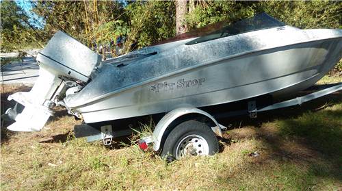 Boat motor and trailer