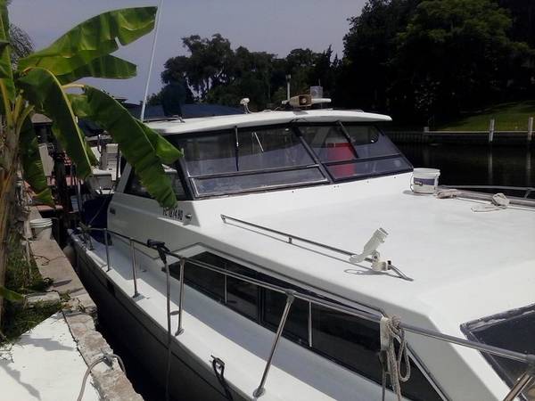 30 Trojan Cabin Cruiser Starbird side on deck